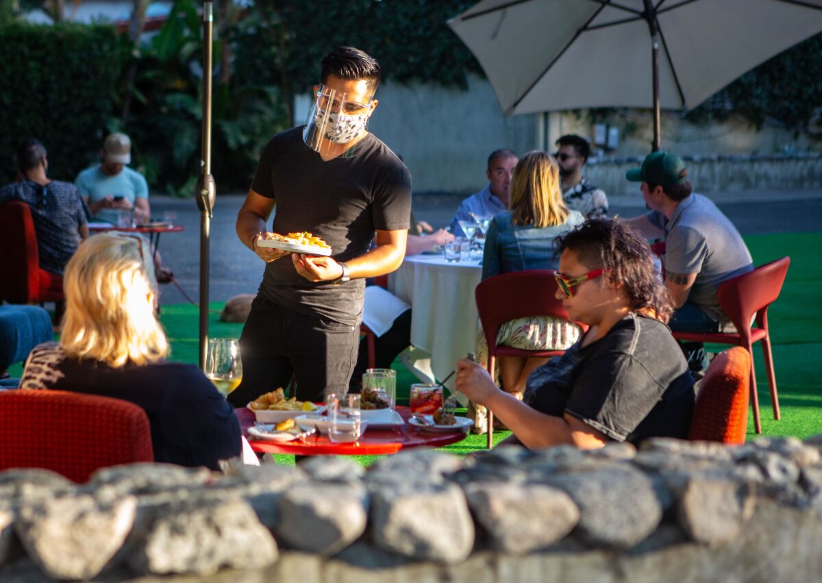 People dine on an outdoor patio 