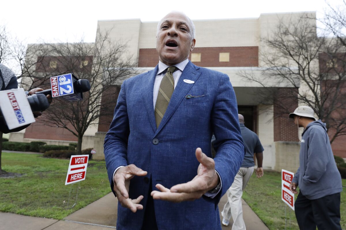 Democratic candidate for U.S. Senate Mike Espy, speaks to reporters about voting in the party primary, in Ridgeland, Miss., Tuesday, March 10, 2020. Espy, a former congressman and former U.S. agriculture secretary, faces two opponents in the party primary. (AP Photo/Rogelio V. Solis)