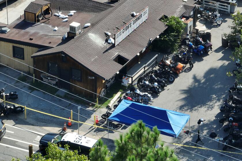 Trabuco Canyon, CA - August 24: An aerial view of investigators working the scene where a gunman killed three people and six were taken to hospitals after a shooting Wednesday night at Cook's Corner, a landmark biker bar at Cook's Corner in Trabuco Canyon Thursday, Aug. 24, 2023. An Ex-cop is the suspected gunman in mass shooting at O.C. biker bar, sources say; 4 dead, 6 injured. (Allen J. Schaben / Los Angeles Times)