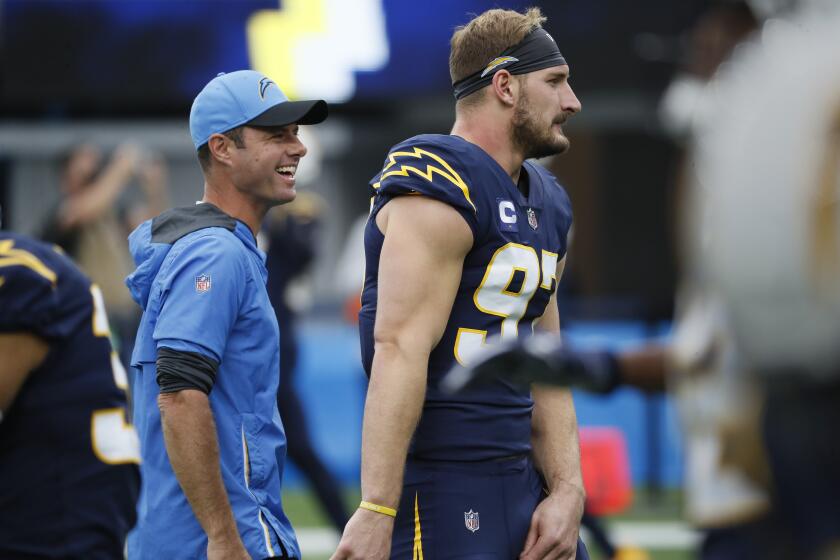 Inglewood, CA, Sunday, October 31, 2021 - Los Angeles Chargers head coach Brandon Staley with Joey Bosa before taking on the New England Patriots at SoFi Stadium. (Robert Gauthier/Los Angeles Times)