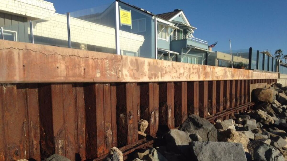 A new FEMA flood map says seawalls such as this one in Del Mar may be insufficient.
