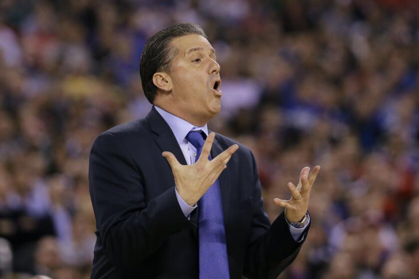 Kentucky head coach John Calipari, early in the game Saturday in which his Wildcats were knocked out of the NCAA championship by Wisconsin.