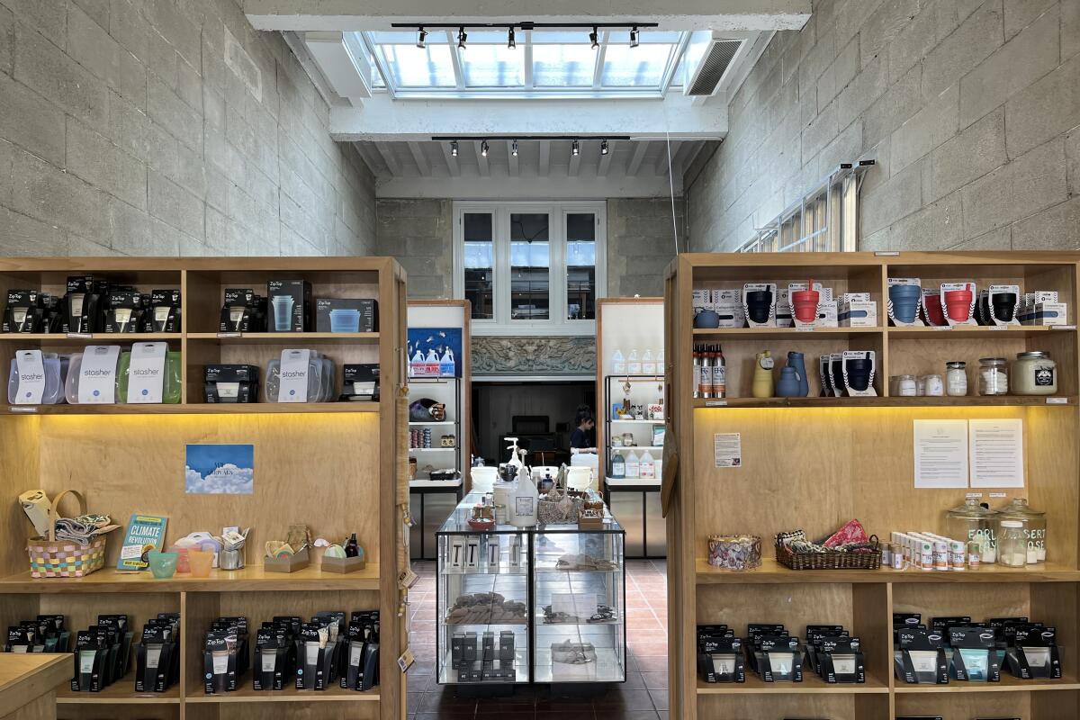Light from a skylight illuminates the products on shelves and in cases at My Zero Waste Store in Pasadena.