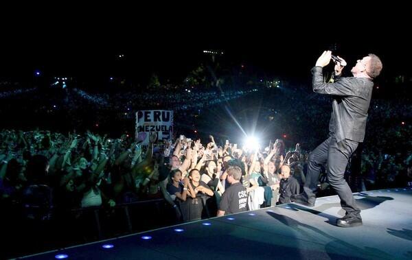 Bono performs and fans react.