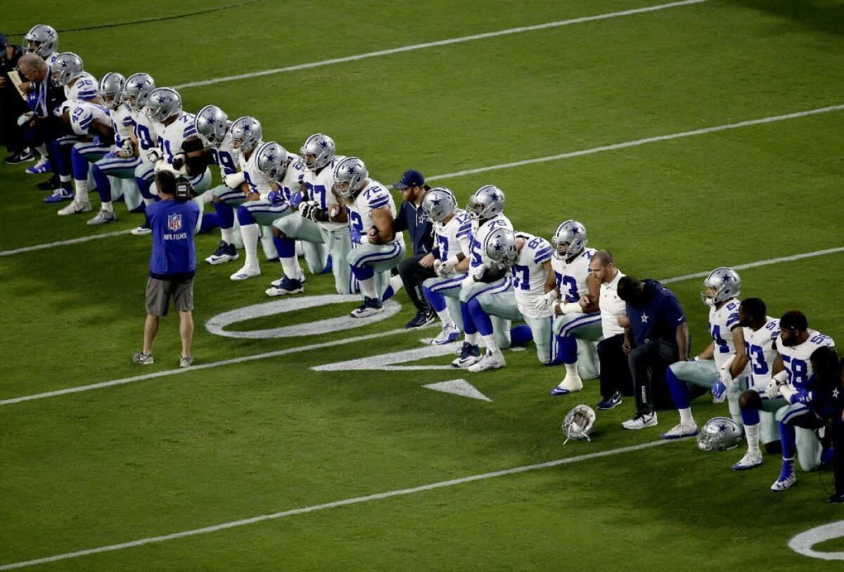 Members of the Dallas Cowboys, including owner Jerry Jones, took a knee before the national anthem ahead of a Monday Night Football game against the Arizona Cardinals.