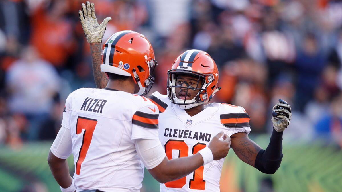 The Cleveland Browns' DeShone Kizer celebrates with Rashard Higgins after a three-yard touchdown run against the Cincinnati Bengals in the fourth quarter on Sunday.