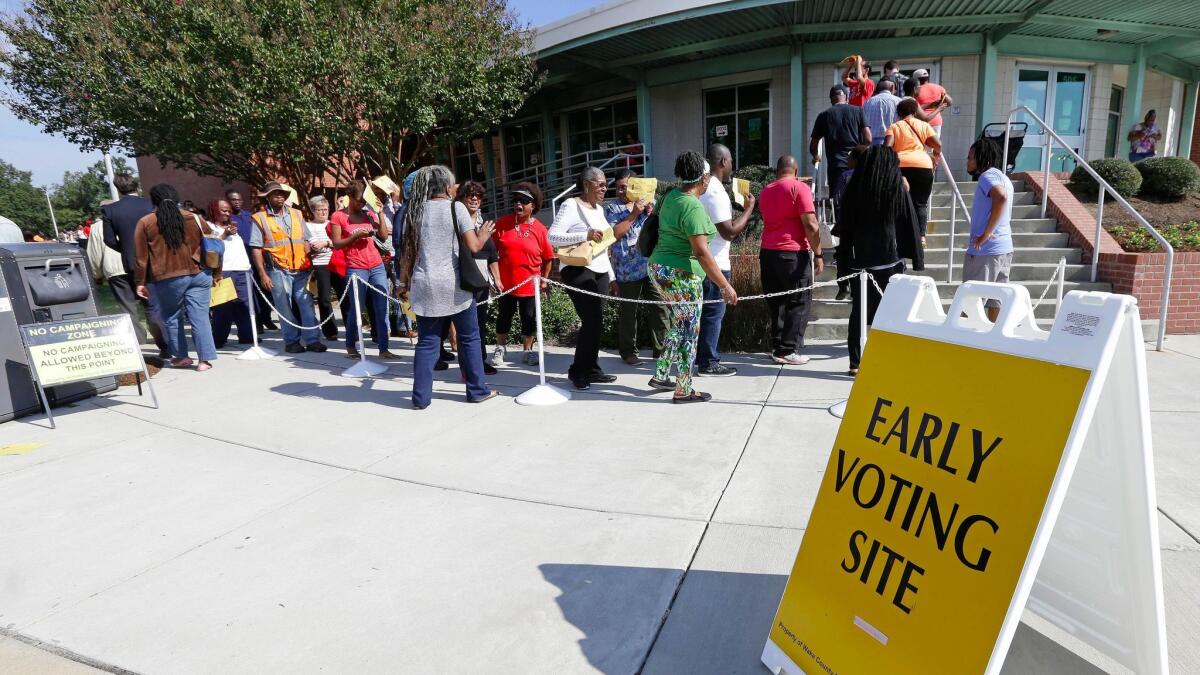 Early voters line up in Raleigh, N.C. A fake advertisement spreading on social media encouraged voters to “avoid the line” and vote by texting. In response, Twitter released an official video along with its own tweet: “Remember: You cannot vote via text or tweet."