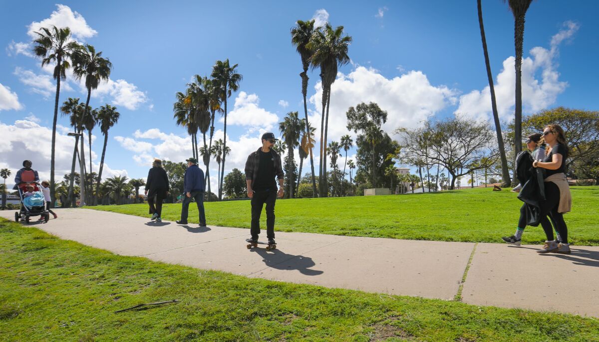 With schools and many businesses closed due to the coronavirus outbreak, many San Diegans headed to Mission Bay Park on March 17 to walk and ride along the path at Leisure Lagoon.