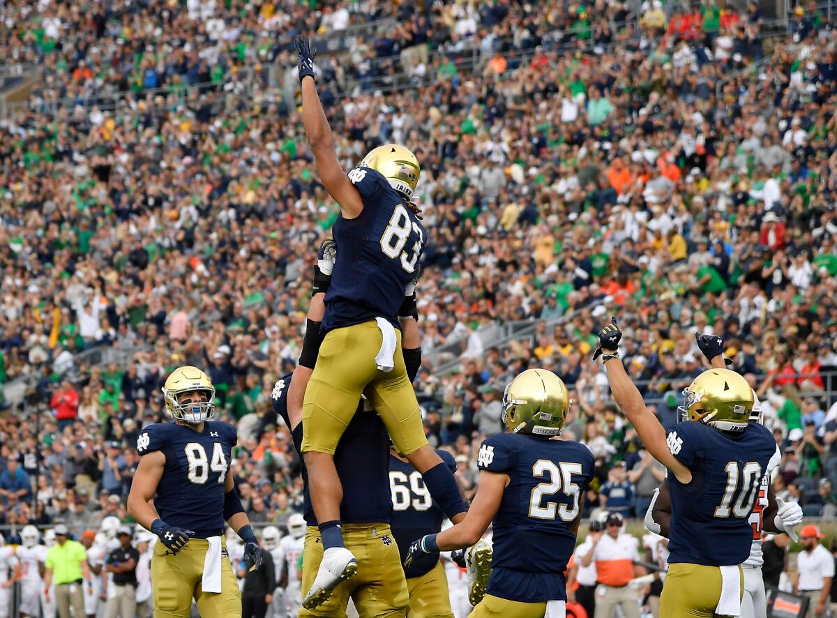 Notre Dame's Chase Claypool (83) celebrates with teammates after scoring a touchdown in the first half against Bowling Green on Saturday in South Bend, Ind.