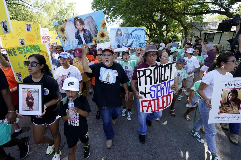 Family and friends of those killed and injured in the school shooting at Robb Elementary take part in a protest march and rally, Sunday, July 10, 2022, in Uvalde, Texas. (AP Photo/Eric Gay)