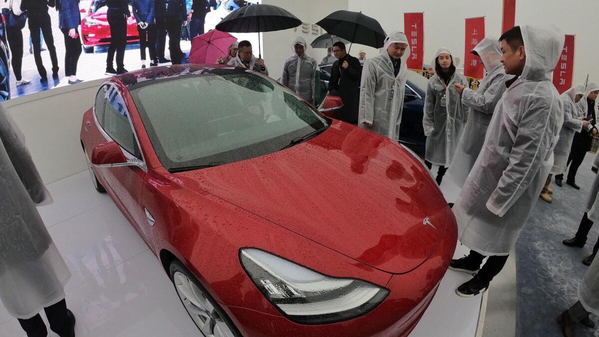 A Tesla Model 3 on display during a groundbreaking ceremony for a Tesla factory in Shanghai on Jan. 7.