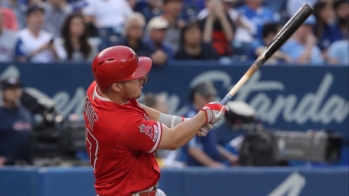 Angels' Mike Trout hits a grand slam in the fourth inning against the Toronto Blue Jays on Wednesday in Toronto.