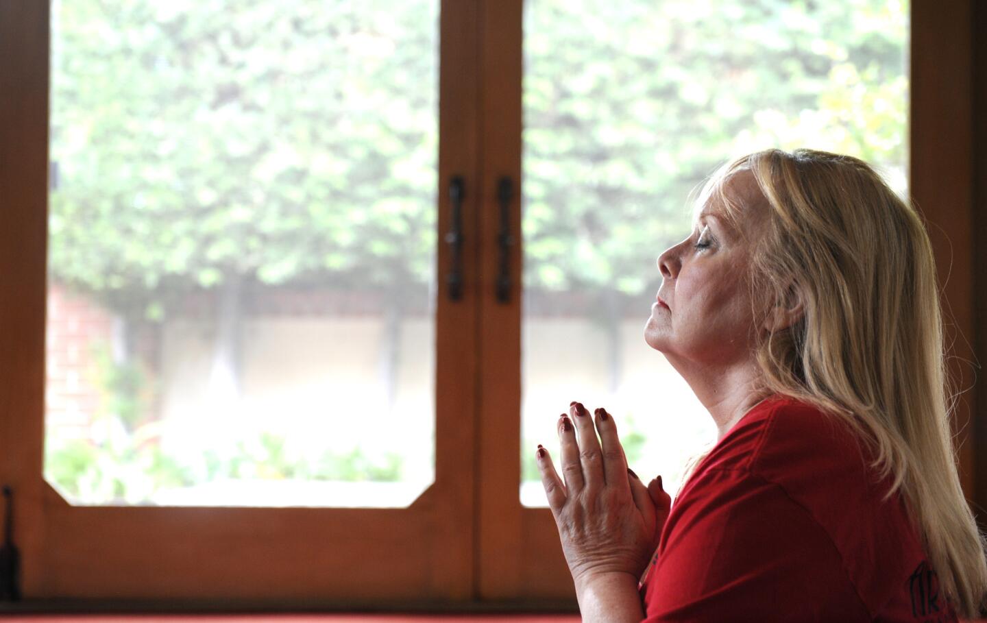 Judi Kaufman meditates during a yoga class at her home in Beverly Hills. Kaufman has battled brain cancer for 18 years and is certain that it has made her a better person.