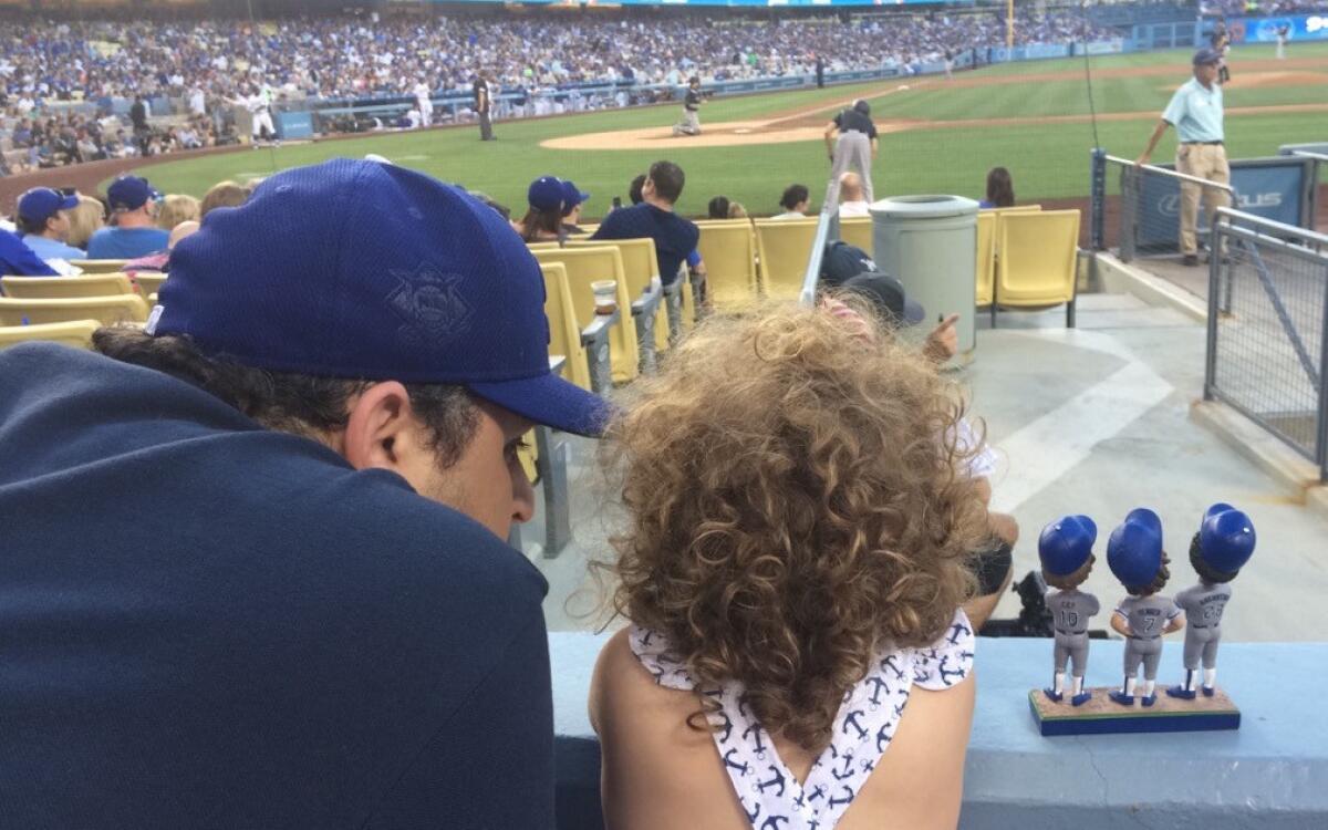 Alex Chazen takes his daughter, Coco, to her first Dodgers game in July 2016.