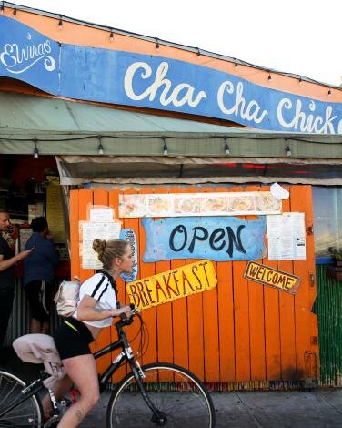 People wait to order food at Cha Cha Chicken in Santa Monica.