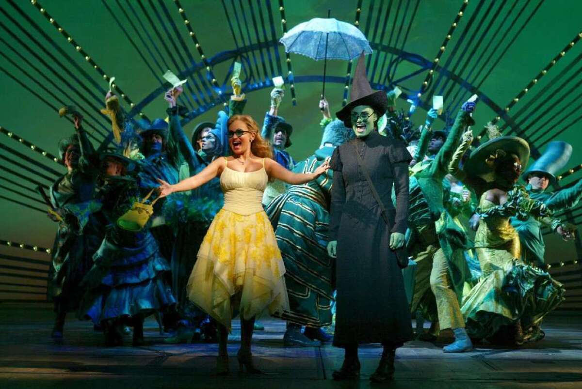 Wicked” was the busiest show of the just-completed Broadway season. Pictured in 2003 are Kristen Chenoweth, left, Idina Menzel and others in the show's original cast.