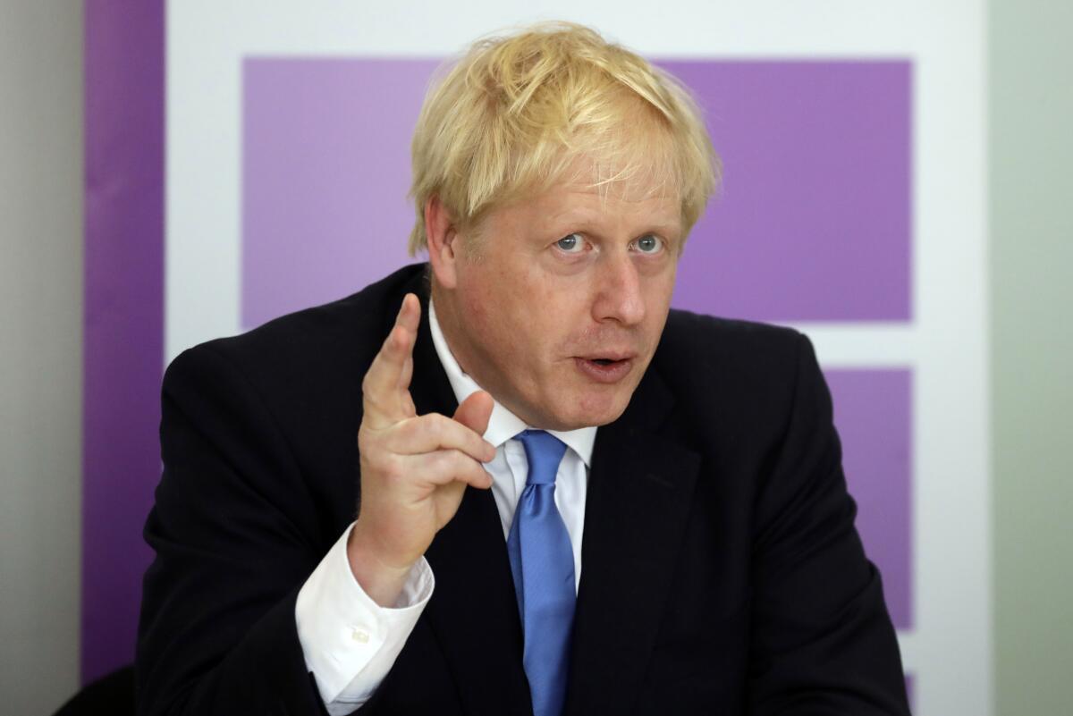 FILE - In this Wednesday, July 31, 2019 file photo, Britain's Prime Minister Boris Johnson speaks during the first meeting of the National Policing Board at the Home Office in London. A key part of the divorce proposals between the EU and Britain centers on keeping the island of Ireland free of physical borders between EU-member Ireland and the Northern Ireland, which is part of the United Kingdom. (AP Photo/Kirsty Wigglesworth, file)