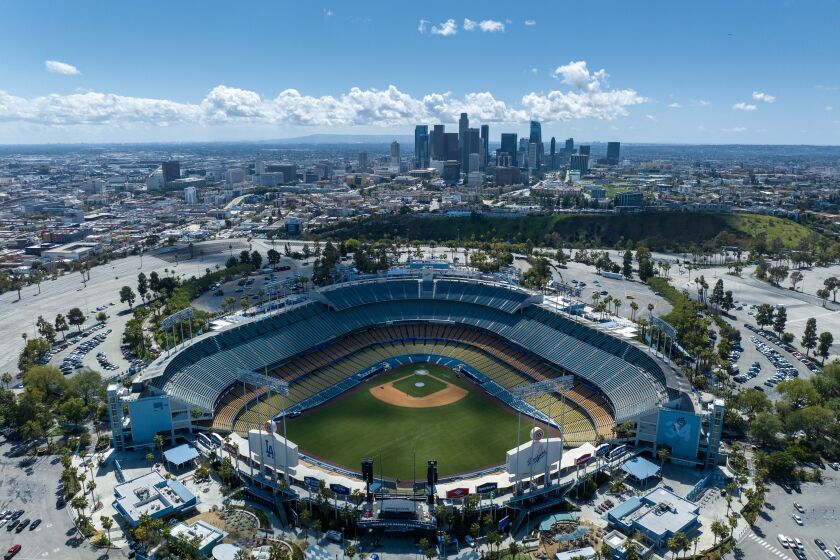 Los Angeles, CA - March 29: Storm clouds move out of the Los Angeles Basin in a view over Dodger Stadium, where tomorrow's night's opener looks dry on Wednesday, March 29, 2023 in Los Angeles, CA. (Brian van der Brug / Los Angeles Times)