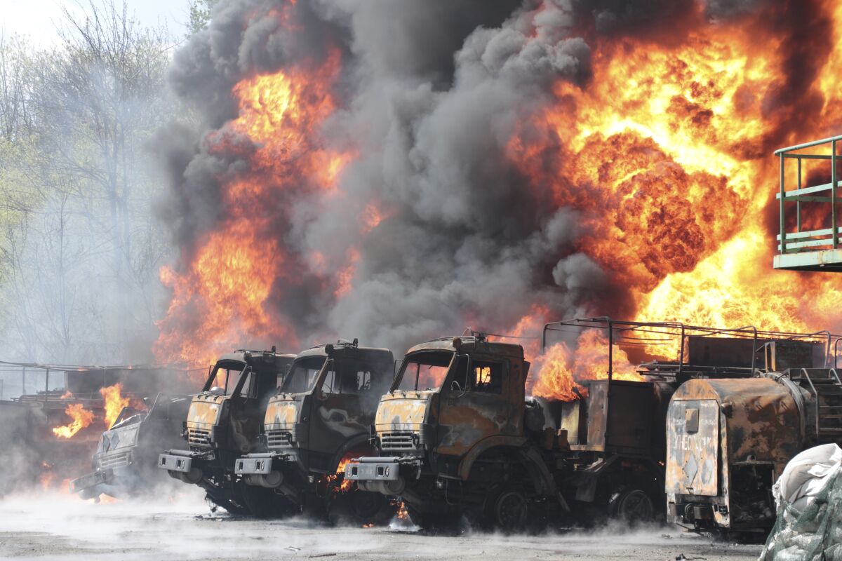 Vehicles on fire at an oil depot
