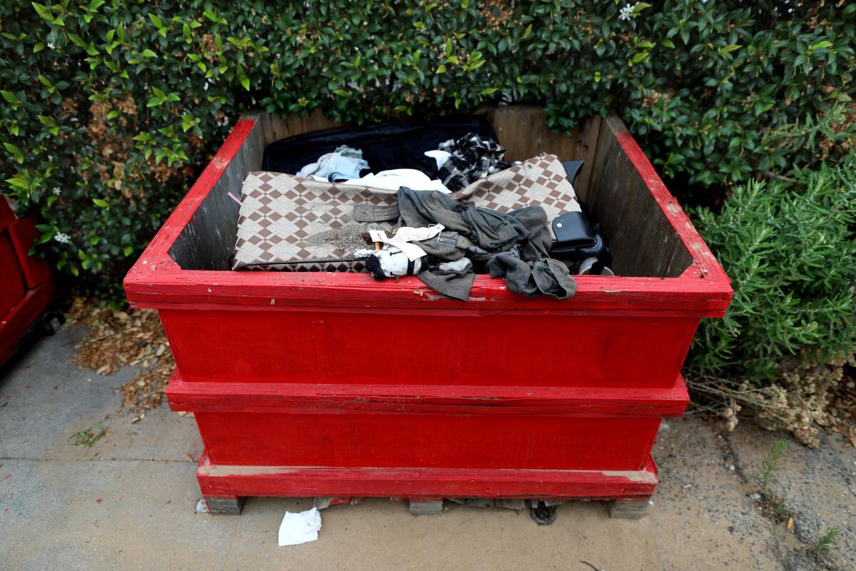 A planter filled trash along the 1800 block of S. Hope Street in Los Angeles. (Gary Coronado / Los Angeles Times)