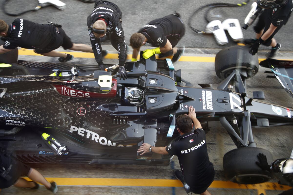 Mercedes driver Valtteri Bottas of Finland stops in the pits during the second practice session prior to the Formula One Grand Prix at the Barcelona Catalunya racetrack in Montmelo, Spain, Friday, Aug. 14, 2020. (AP Photo, Emilio Morenatti, Pool)