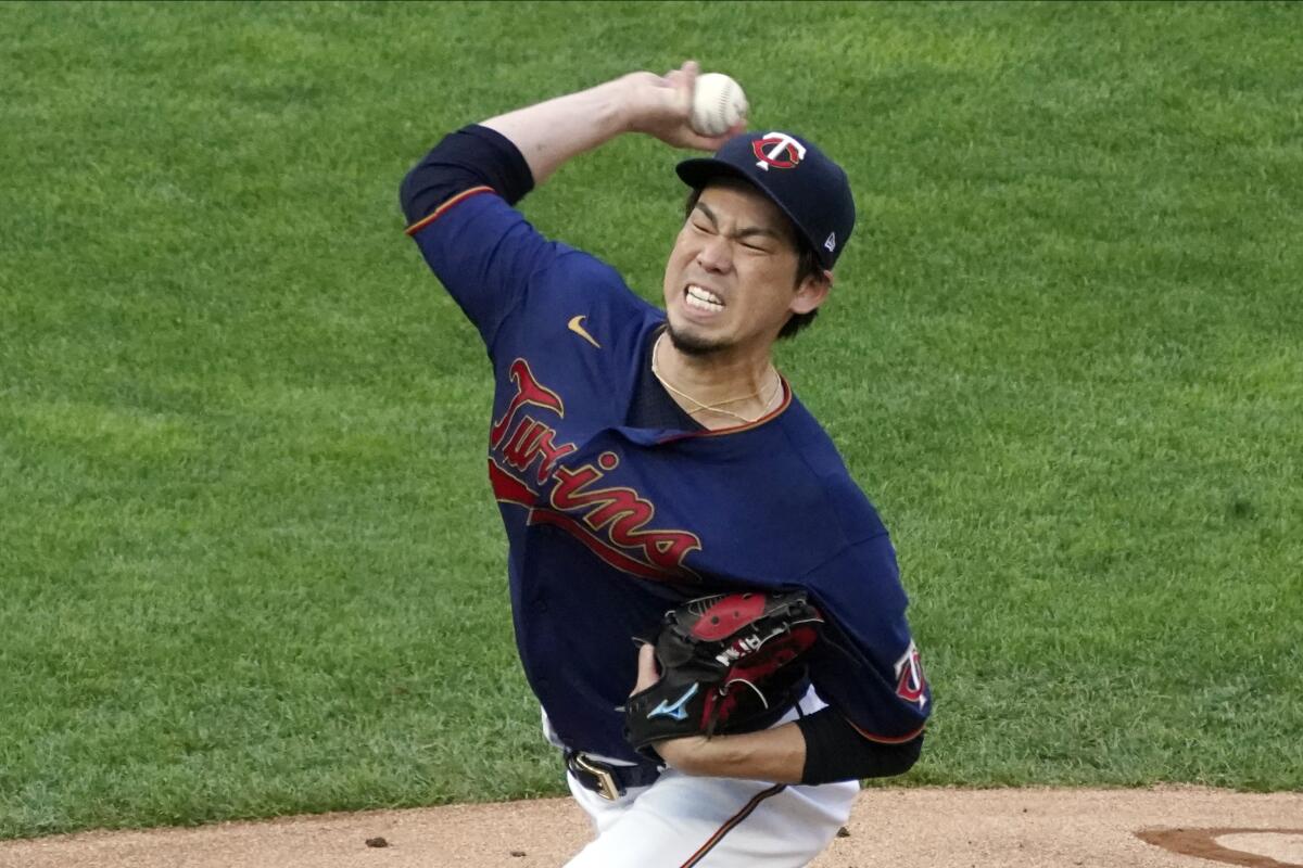 Minnesota Twins pitcher Kenta Maeda throws to a Detroit Tigers batter during the first inning of a baseball game Friday, July 9, 2021, in Minneapolis. (AP Photo/Jim Mone)