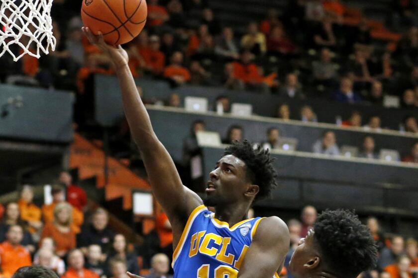 UCLA guard Isaac Hamilton drives for a basket against Oregon State during the second half of their game on Wednesday.