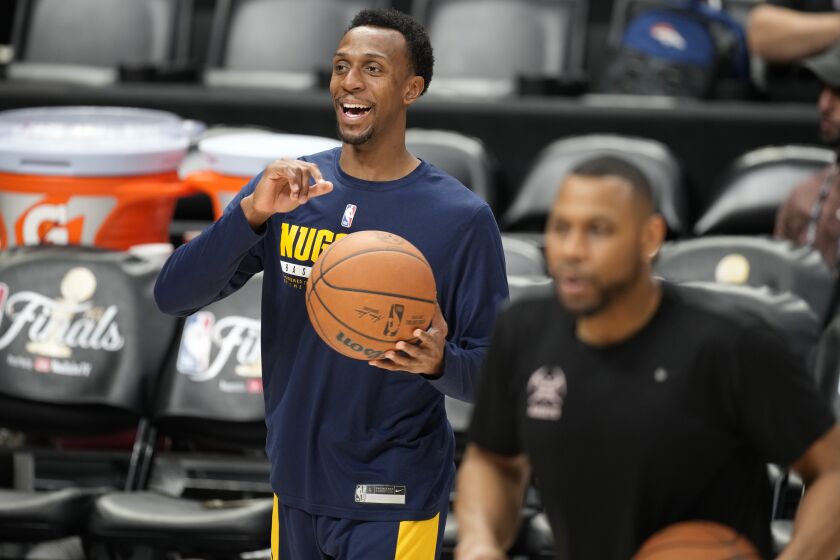 Denver Nuggets guard Ish Smith jokes with teammates during practice for Game 2 of the NBA Finals, Saturday, June 3, 2023, in Denver. (AP Photo/David Zalubowski)
