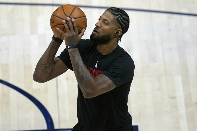 Los Angeles Clippers guard Paul George warms up before an NBA basketball game against the Utah Jazz Friday, Jan. 1, 2021, in Salt Lake City. (AP Photo/Rick Bowmer)