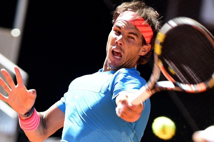 Rafael Nadal returns a shot against Simone Bolelli during a third-round match at the Madrid Open on Thursday.