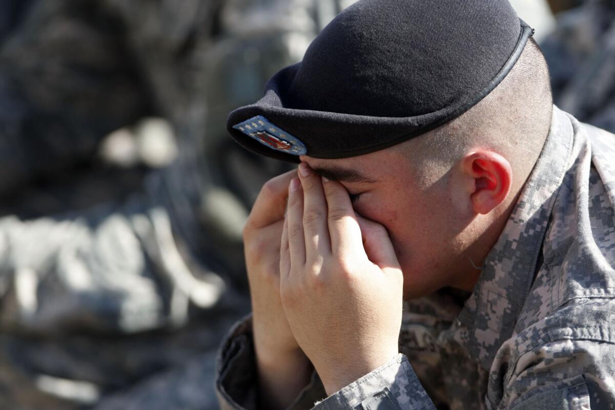AnArmy soldier reacts during the Fort Hood Memorial Ceremony at Fort Hood, Texas in November 2009. The memorial was held to honor the 13 victims of the shootings.