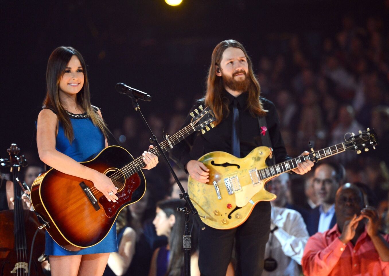 Singer Kacey Musgraves and another performer onstage during the 2013 Billboard Music Awards.