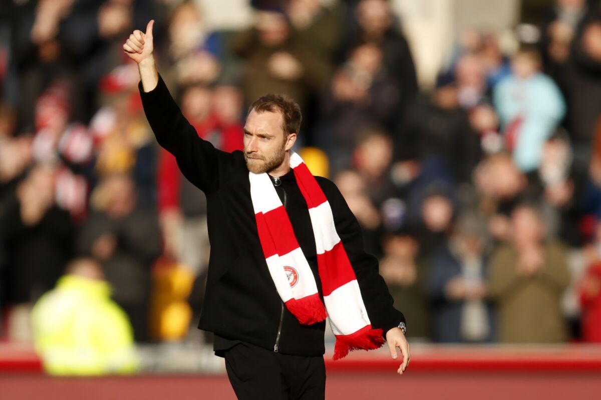 Brentford's Christian Eriksen gestures as he walks in the field ahead of the English Premier League soccer match between Brentford and Crystal Palace at Brentford Community stadium in London, Saturday, Feb. 12, 2022. (AP Photo/David Cliff)