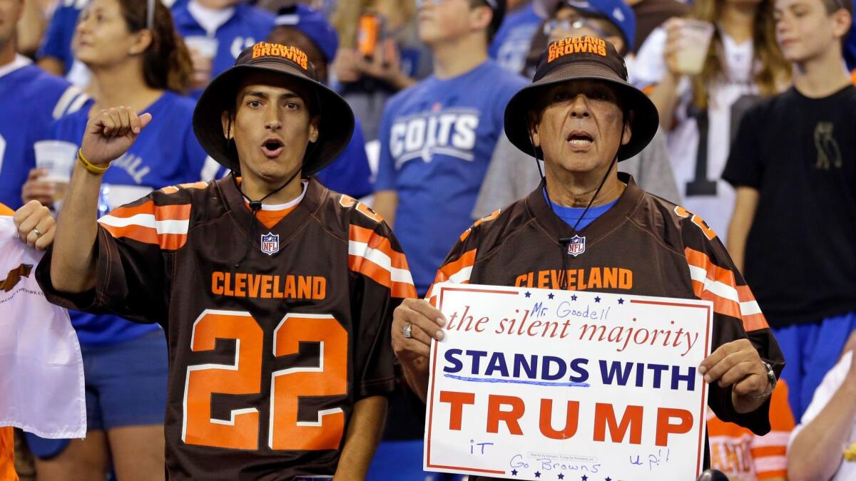 Cleveland Browns fans hold a sign following the national anthem.