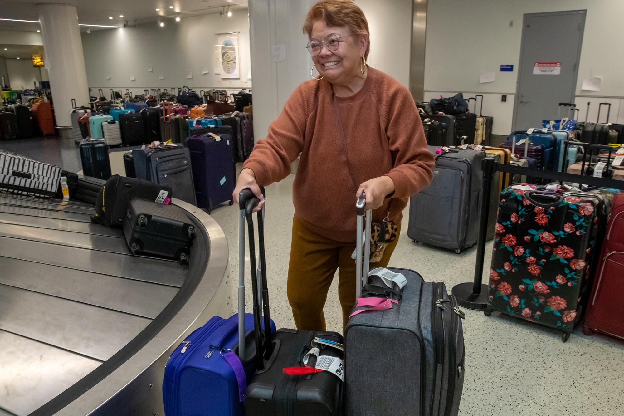 Rosanna Domingo, 68, arrives at LAX on Weednesday after facing Southwest Airlines flight cancellations