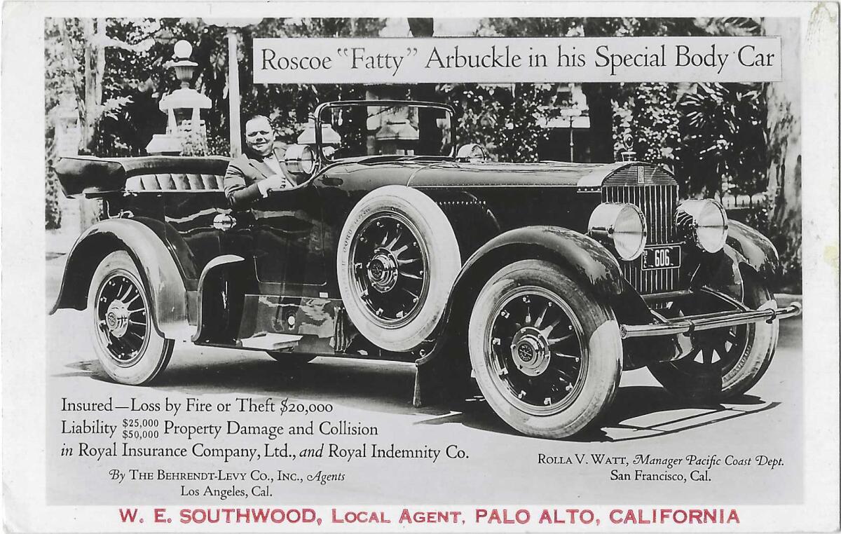 Black and white postcard, likely an insurance advertisement, with man in vintage car. 