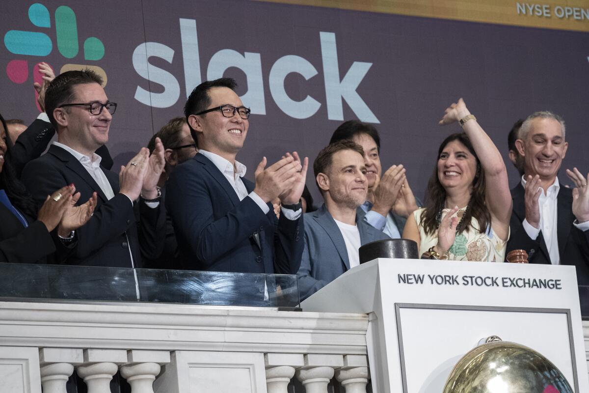 Slack executives ring the opening bell at the New York Stock Exchange on June 20, 2019.
