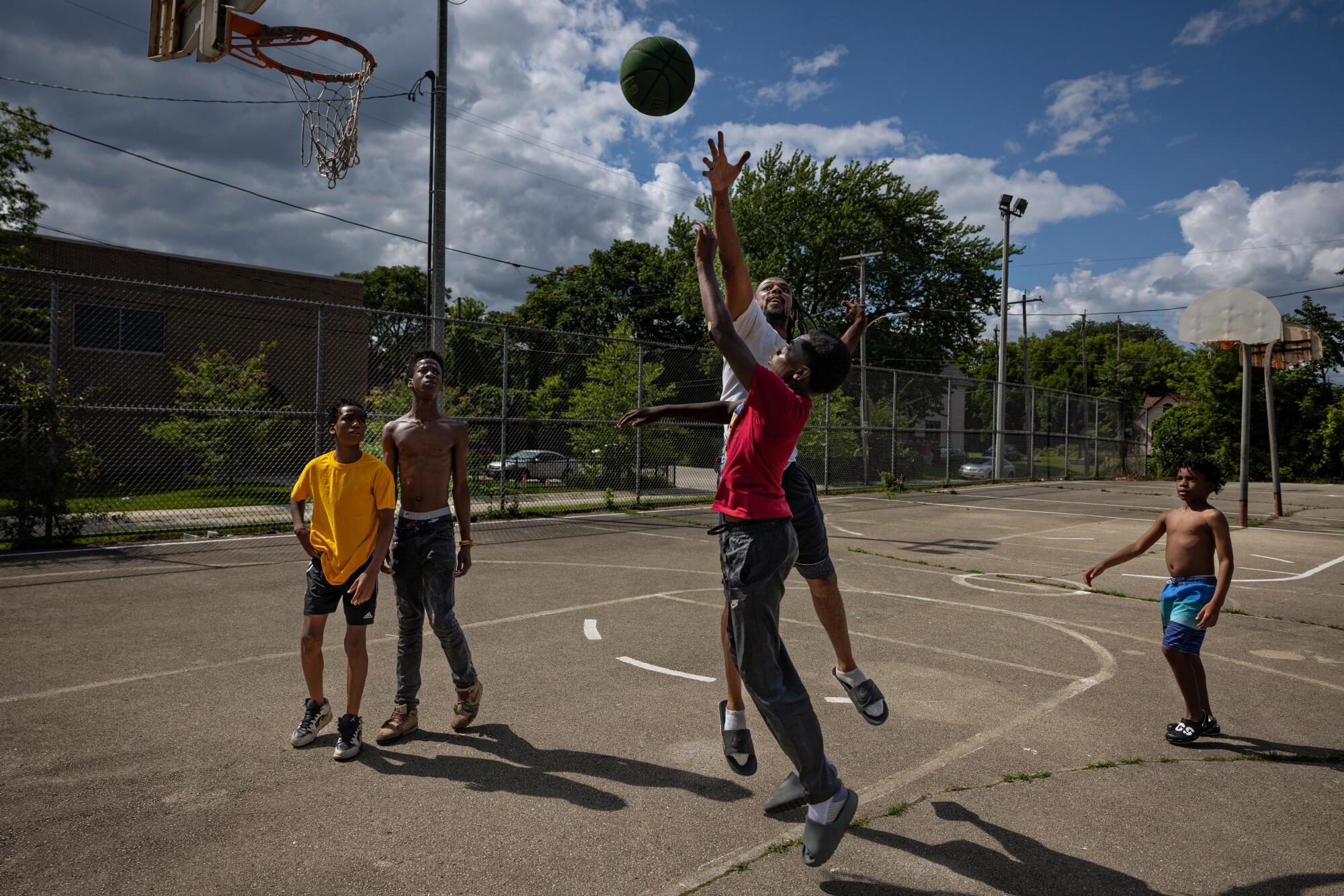 Kids play basketball at the Milwaukee Childcare Collective event.
