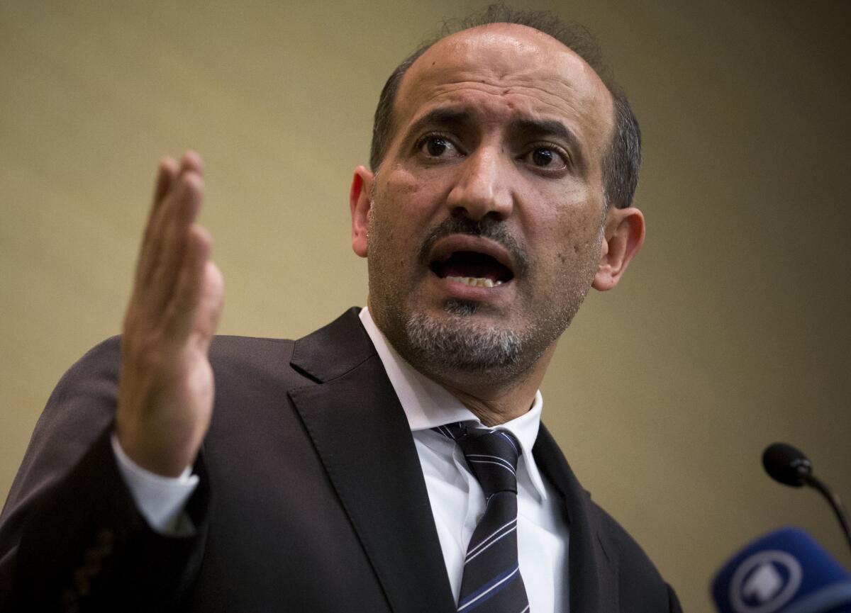 Ahmad Jarba, leader of the Syrian National Coalition, the major opposition group, speaks at a news conference in Geneva.