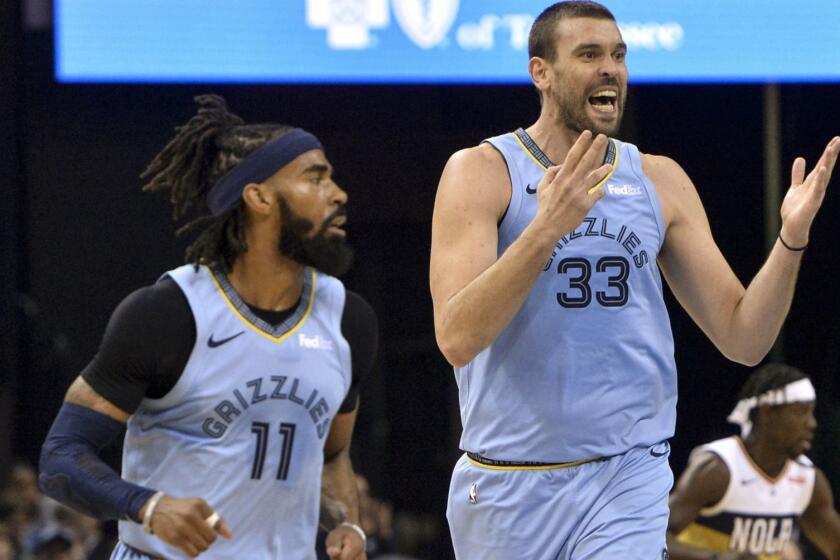 Memphis Grizzlies center Marc Gasol (33) reacts as he and guard Mike Conley (11) play in the first half of an NBA basketball game against the New Orleans Pelicans Monday, Jan. 21, 2019, in Memphis, Tenn. (AP Photo/Brandon Dill)