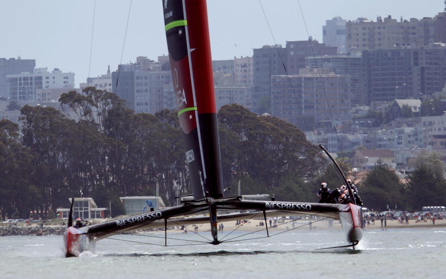 Emirates Team New Zealand sails near the city skyline during the round robin one yacht races of the Luis Vuitton Cup challenger series in the 34th America's Cup in San Francisco