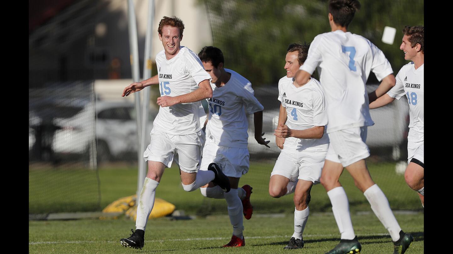 Corona del Mar High's David Stephenson, far left, gives the Sea Kings a 1-0 lead during the first half against Woodbridge in a Pacific Coast League match on Tuesday.