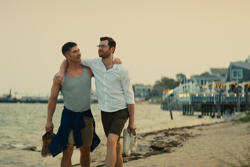 Luke Macfarlane, left, and Billy Eichner in a scene from "Bros."