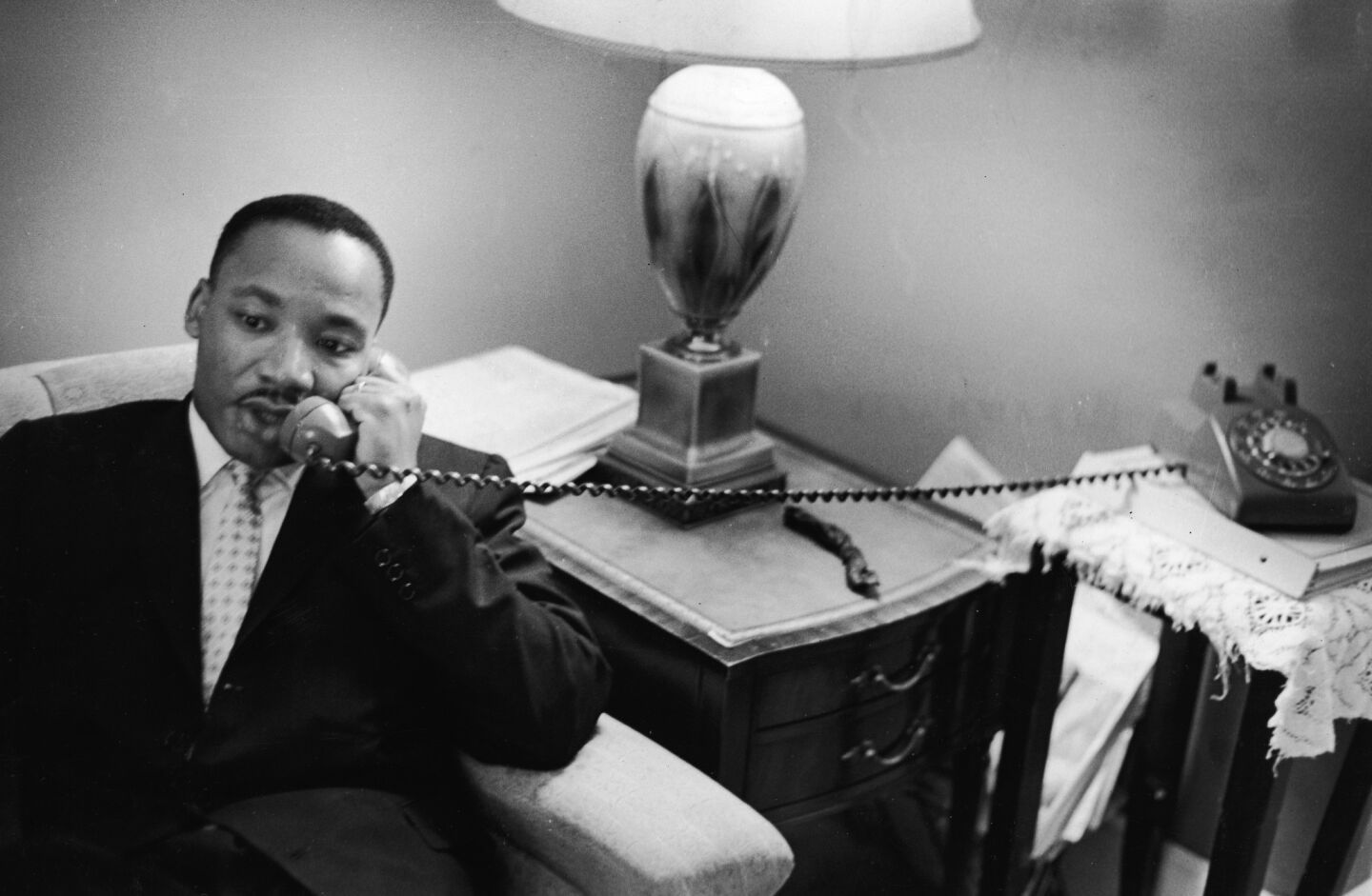 The Rev. Martin Luther King Jr. speaks on the phone after encountering a white mob protesting against the Freedom Riders in Montgomery, Ala., in May 1961.