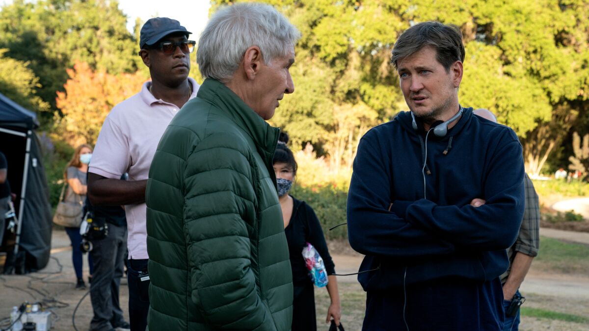 Harrison Ford in a green puffer jacket and Bill Lawrence on the set of "Shrinking."