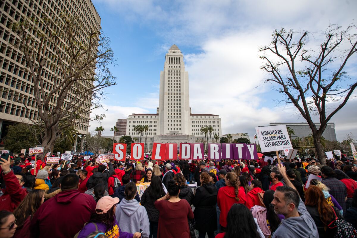  A crowd gathers in Grand Park in front of Los Angeles City Hall.
