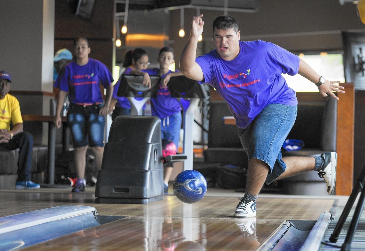 Special Olympics athlete Jorzy Arias trains with his Aruba bowling teammates at Tavern + Bowl in Costa Mesa on Wednesday morning.