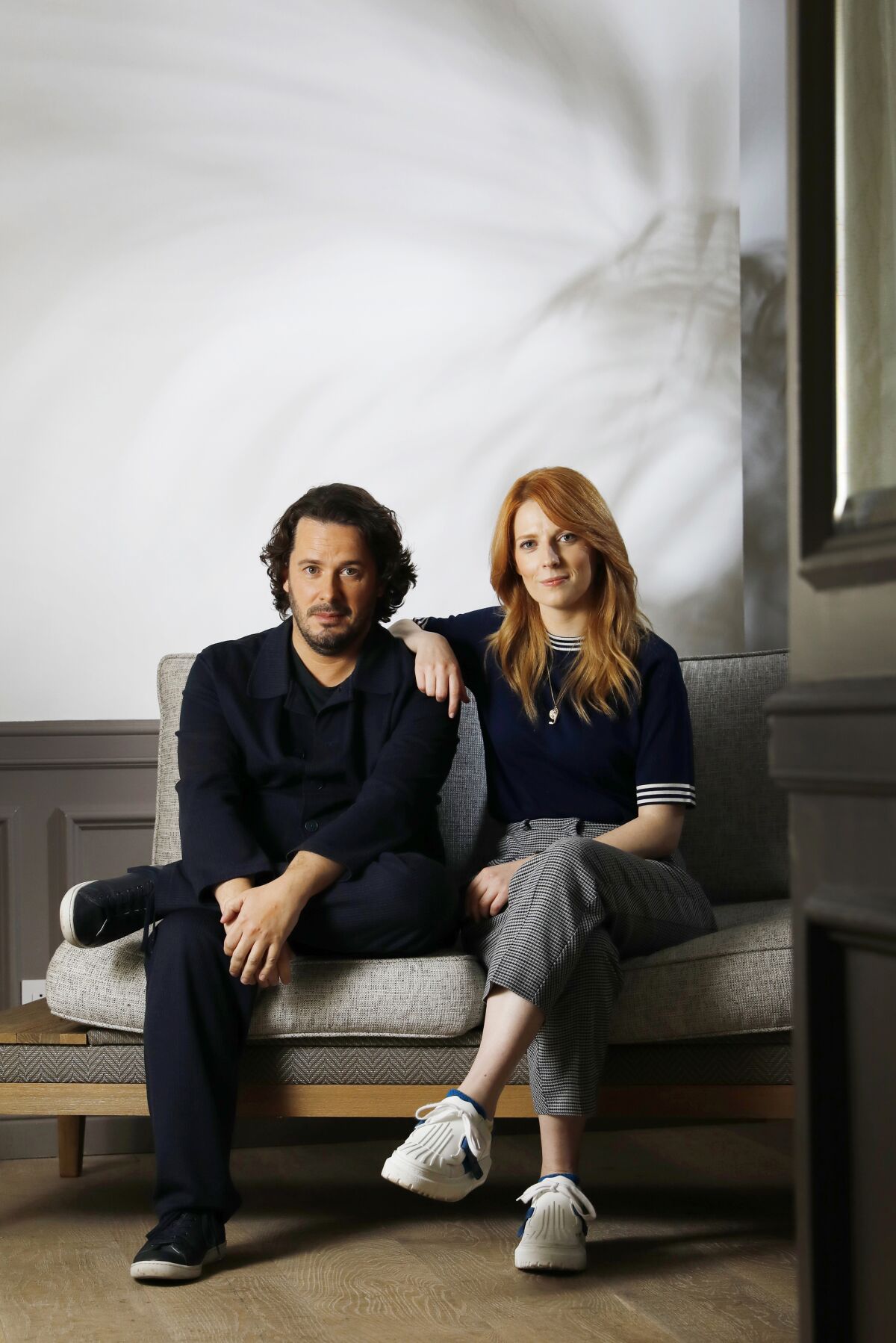 Edgar Wright and Krysty Wilson-Cairns sit on a sofa