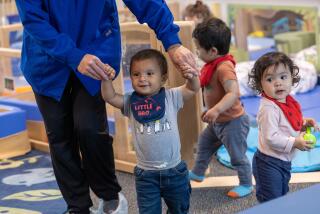 Long Beach, CA - March 20: Mario gets some help walling during class at Educare Los Angeles at Long Beach, a very high-quality child care center in Long Beach on Wednesday, March 20, 2024 in Long Beach, CA. (Brian van der Brug / Los Angeles Times)