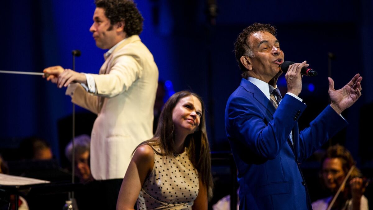 Conductor Gustavo Dudamel, from left, and singers Sutton Foster and Brian Stokes Mitchell in the Los Angeles Philharmonic's Bernstein program at the Hollywood Bowl Tuesday night
